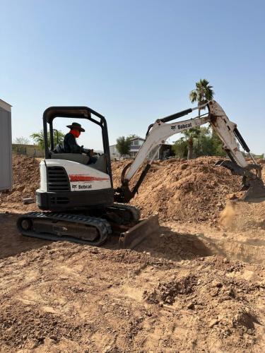 Digging a pit for a ground set home.